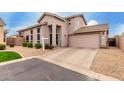 Inviting two-story home with a two-car garage, xeriscaping, and mature landscaping at 16036 N 11Th Ave # 1126, Phoenix, AZ 85023