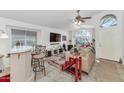 Open-concept living room with tile flooring, ample natural light, and stylish furnishings at 1918 E Williams Dr, Phoenix, AZ 85024