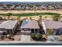 Beautiful home with solar panels in a neighborhood, perfect for sustainable living with golf course views at 22050 N Balboa Dr, Maricopa, AZ 85138