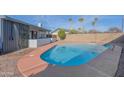 Inviting backyard pool with an outdoor shower and a surrounding patio for relaxation and enjoyment at 2507 E Golden St, Mesa, AZ 85213