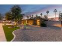 Stylish single-story home showcasing modern landscaping, a stone driveway, a brick facade, and desert plants at 2920 S Bala Dr, Tempe, AZ 85282