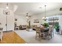 Expansive living room with a dining area, a chandelier, and stylish decor at 3017 S Mesita --, Mesa, AZ 85212