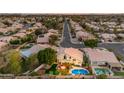 Aerial shot showcasing the property's pool, mature landscaping, and peaceful neighborhood setting at 3482 W Shannon St, Chandler, AZ 85226