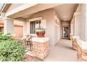 Inviting front porch with decorative planter, stylish door, and stacked stone column at 38572 N Jessica Ln, San Tan Valley, AZ 85140