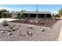 Quaint home with desert landscaping, showcasing cacti and gravel for low maintenance appeal at 422 S 76Th Way, Mesa, AZ 85208