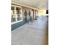 Relaxing covered patio area with comfortable seating, perfect for outdoor enjoyment and entertaining at 422 S 76Th Way, Mesa, AZ 85208