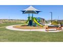 Community playground featuring modern play structures, benches, and well-maintained landscaping in a Gathering-friendly neighborhood at 4264 W Hannah St, San Tan Valley, AZ 85144