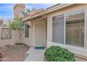 Inviting front entryway with a security door, desert landscaping, and a 'hello' welcome mat for a warm greeting at 473 S Ash St, Gilbert, AZ 85233