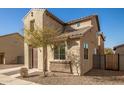 Charming two-story home with stone accents and a well-manicured desert landscape at 5430 W Odeum Ln, Phoenix, AZ 85043