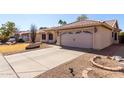 Charming single-story home featuring a two-car garage, neutral stucco exterior, and desert landscaping at 6401 W Irma Ln, Glendale, AZ 85308