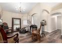 Comfortable living room featuring stylish furnishings and an open floor plan at 6401 W Irma Ln, Glendale, AZ 85308