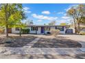 Charming single-story home with a well-manicured front yard, providing a welcoming curb appeal at 6524 N 13Th St, Phoenix, AZ 85014