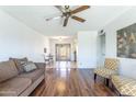 Spacious living room with hardwood floors, ceiling fan and abundant natural light at 8355 E Thomas Rd, Scottsdale, AZ 85251