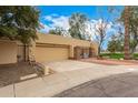 Attached two-car garage with extra space on a well maintained lot at 9090 N 86Th Pl, Scottsdale, AZ 85258