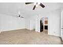 Bright living room with an open layout, featuring light-colored herringbone floors at 110 N 66Th Ave, Phoenix, AZ 85043