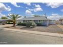 Charming single-story home with xeriscape front yard and mature landscaping at 12408 N Cherry Hills W Dr, Sun City, AZ 85351