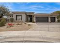 Charming single-story home with a well-manicured desert landscape and a two-car garage at 15229 E Marigold Ct, Fountain Hills, AZ 85268