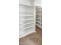 Walk-in closet featuring multiple levels of built-in shelving at 1655 W Wilson Ave, Coolidge, AZ 85128