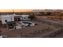 Expansive backyard featuring a private pool, covered patio and desert landscaping against a mountain backdrop at 1775 N Starr Rd, Apache Junction, AZ 85119