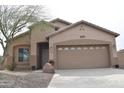 Appealing single-story home with a two-car garage, well-kept desert landscaping, and a cozy front entrance at 1813 N Lewis Pl, Casa Grande, AZ 85122