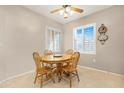 Cozy breakfast nook with bright windows and a ceiling fan at 18668 N Lariat Ct, Surprise, AZ 85387