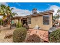 Expansive backyard showing a covered patio, desert landscaping, and a tiled entertaining space at 1973 E Buena Vista Dr, Chandler, AZ 85249