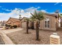 Charming home exterior with desert landscaping and mature palm trees in the front yard at 1973 E Buena Vista Dr, Chandler, AZ 85249