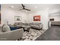 Comfortable living room featuring modern furnishings, stylish decor, and a ceiling fan at 2227 W Cambridge Ave, Phoenix, AZ 85009