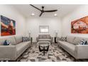 Inviting living room showcasing comfortable seating and a ceiling fan at 2227 W Cambridge Ave, Phoenix, AZ 85009