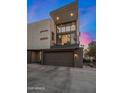 Modern two-story townhome showcasing balcony and attached two-car garage at 3106 N 70Th St # 2003, Scottsdale, AZ 85251