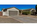 Well-maintained single-story home with a spacious driveway, desert landscaping, and a two-car garage at 3194 E Mead Dr, Chandler, AZ 85249