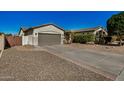 Well-maintained single-story home with a spacious driveway, desert landscaping, and a two-car garage at 3194 E Mead Dr, Chandler, AZ 85249