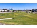 Expansive community park with playground, benches and walking path at 4280 W Hannah St, San Tan Valley, AZ 85144