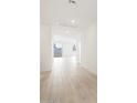 Bright hallway with modern tile flooring leading to various rooms at 4280 W Hannah St, San Tan Valley, AZ 85144