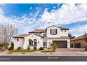 Stunning two-story home featuring a meticulously landscaped front yard and a spacious three-car garage at 5139 S Bridal Vail Dr, Gilbert, AZ 85298