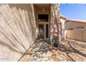 Exterior shot of a property's entrance showing a secure front door with a desert landscape at 5356 W Jupiter Way, Chandler, AZ 85226