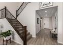 Welcoming entryway with a staircase, wood-look flooring, and neutral decor at 5539 S Verde --, Mesa, AZ 85212