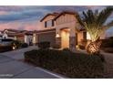 Inviting front exterior showcasing desert landscaping, stone accents, and a covered entrance at 5539 S Verde --, Mesa, AZ 85212