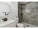 Modern bathroom features beautiful gray tile shower and stylish fixtures at 6009 N 79Th St, Scottsdale, AZ 85250