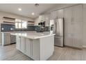 Modern kitchen featuring stainless steel appliances, quartz countertops, and stylish backsplash at 726 E Aire Libre Ave, Phoenix, AZ 85022