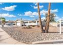 Charming home with rock landscaping, a two-car garage, and a sunny day at 790 N Meadows Dr, Chandler, AZ 85224