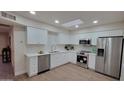 Modern kitchen with white cabinets, stainless steel appliances, and stylish backsplash tiles at 7950 E Keats Ave # 150, Mesa, AZ 85209