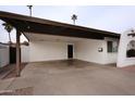 Spacious carport with brick pillars and overhead lighting offers ample parking and protection from the elements at 1058 W Emelita Ave, Mesa, AZ 85210