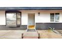Inviting front entrance with black trim and a bay window, leading to a bright interior at 1216 N 66Th Pl, Mesa, AZ 85205