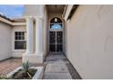 Inviting front entry featuring decorative columns, unique hanging lantern and security door at 1635 E Silverwood Dr, Phoenix, AZ 85048