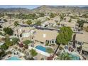 Overhead view of a single-story home with a backyard pool and lush landscaping at 1835 E Brookwood Ct, Phoenix, AZ 85048