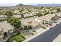 Aerial view of a tan single-story home with desert landscaping in a suburban neighborhood at 1835 E Brookwood Ct, Phoenix, AZ 85048