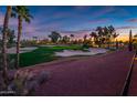 Scenic golf course view with manicured greens, sand traps, and mature trees at 22329 N Padaro Dr, Sun City West, AZ 85375
