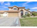 Front exterior view of home with neutral color, desert landscaping, and two-car garage at 2340 W Myrtle Dr, Chandler, AZ 85248