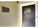 Close-up of front door showcasing historic plaque on this well-maintained home at 34 W Vernon Ave, Phoenix, AZ 85003